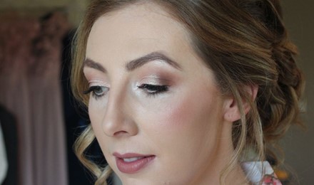 bridesmaid looking down showing her eye make up application