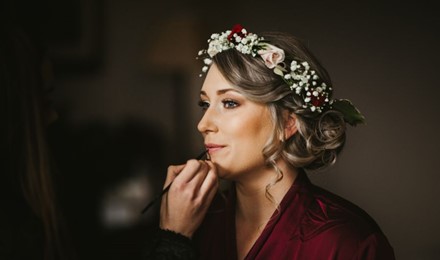 Kate having her lipstick touched up , Bridesmaid makeup, flower crown , brown natural eyemakeup , mount falcon co mayo.